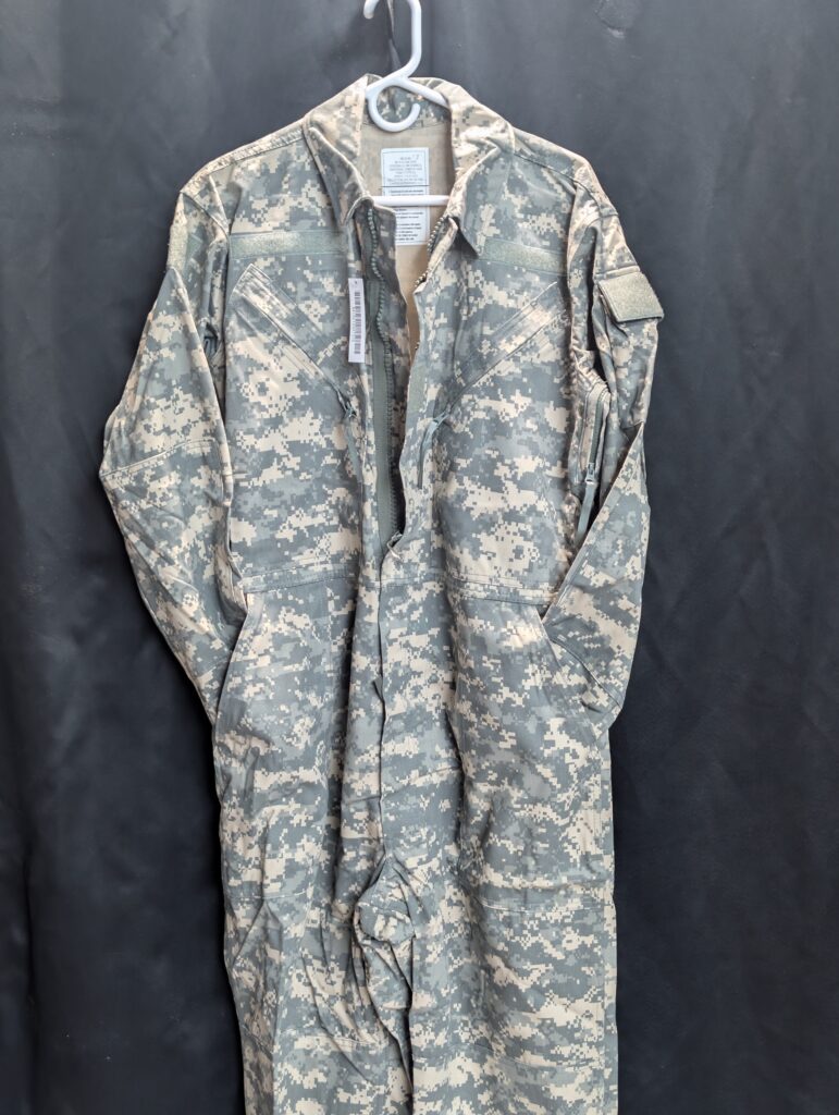 Authentic United States military surplus medium size universal camouflage print mechanics coveralls manufactured by Carter Enterprises featuring heavy duty zippers and durable reinforced fabric structure today.
