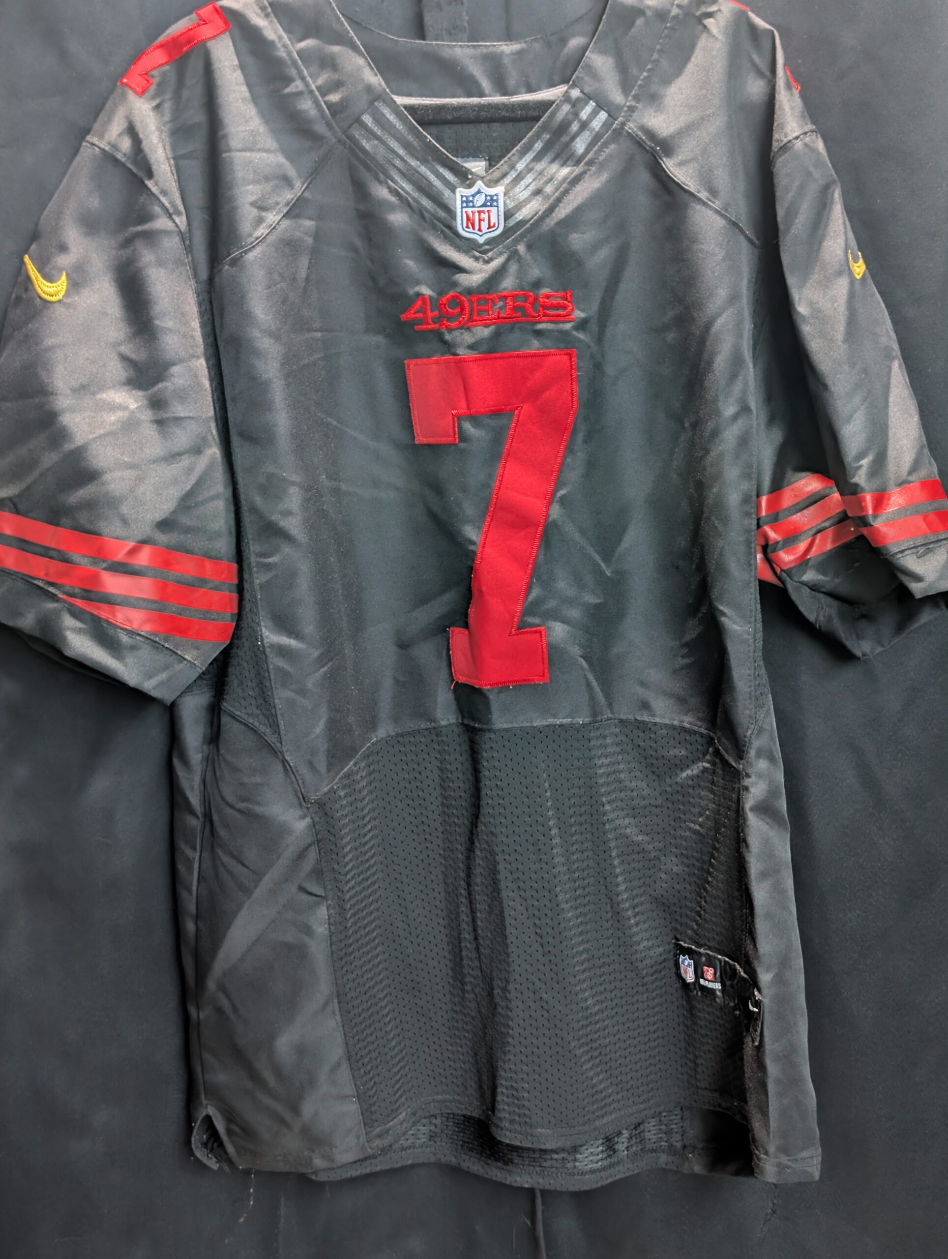 Authentic used black Nike San Francisco forty niners Colin Kaepernick football jersey in size forty eight displaying classic red stitched numbers perfectly captured for premium sports apparel collectors.