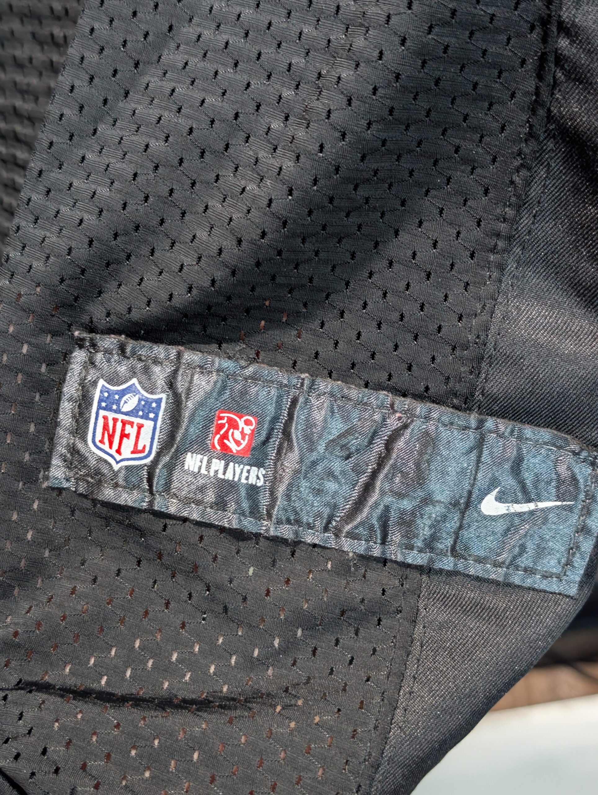 Authentic used black Nike San Francisco forty niners Colin Kaepernick football jersey in size forty eight displaying classic red stitched numbers perfectly captured for premium sports apparel collectors.
