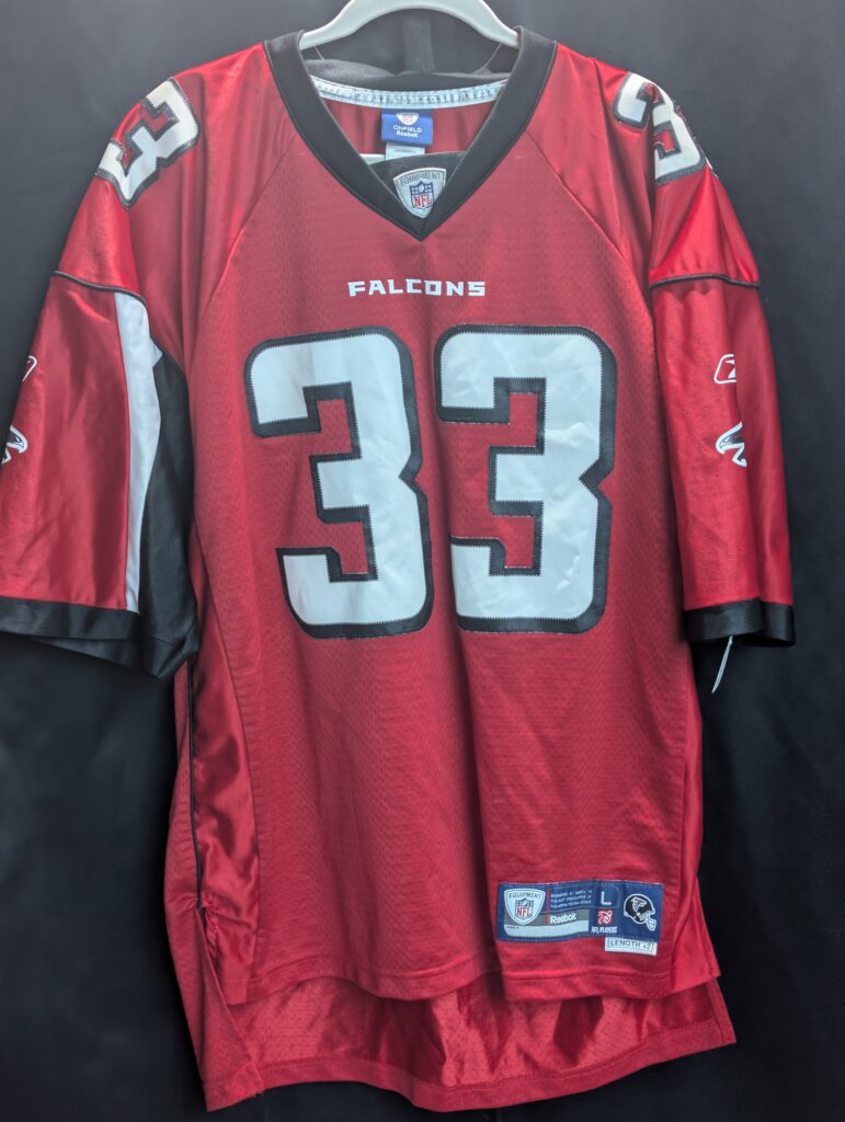 Front, back, and close-up tag views of a red Reebok Atlanta Falcons Michael Turner #33 jersey, men's size Large.