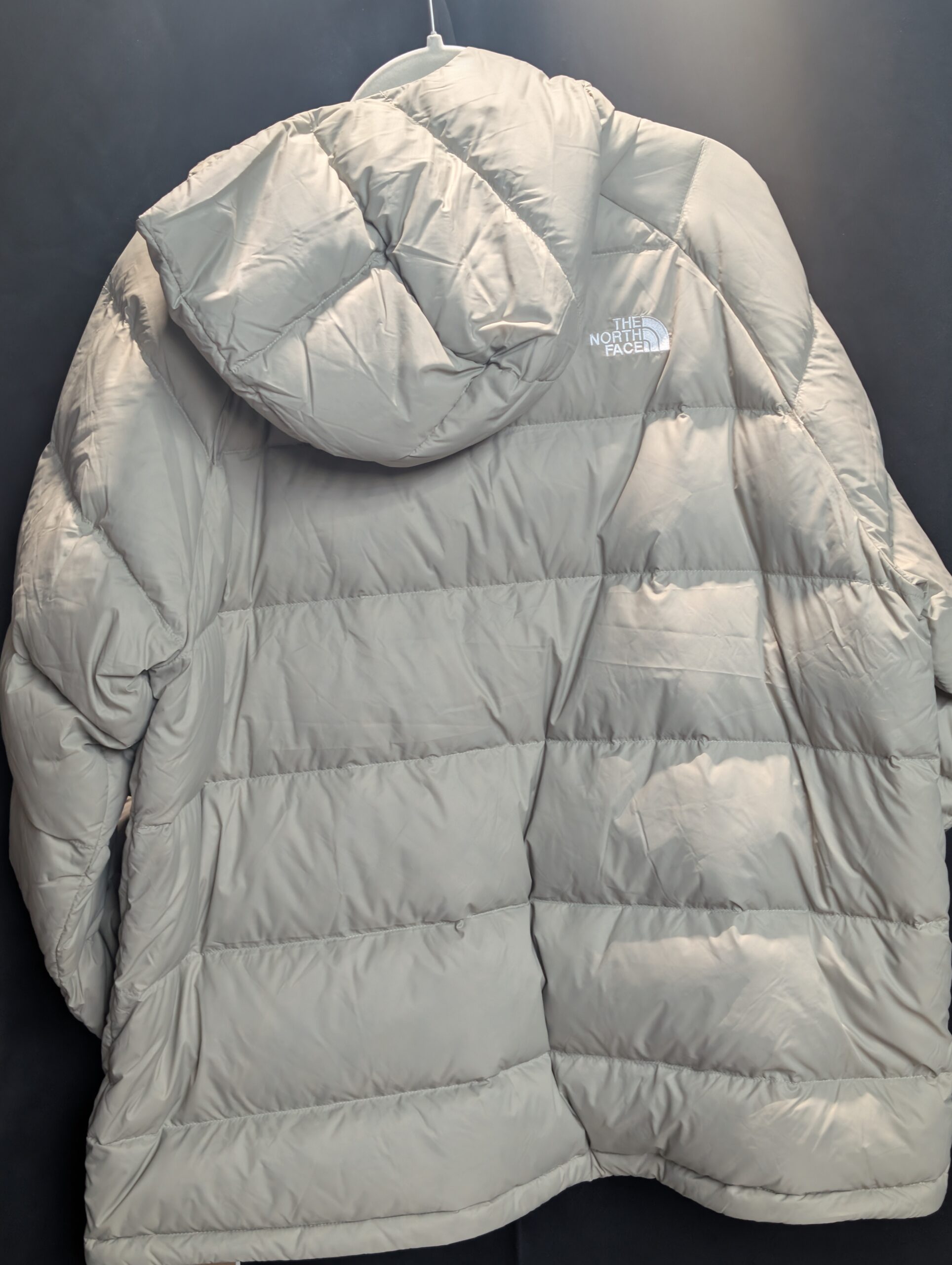 Front view of The North Face Mens Hydrenalite Hoodie in Clay Grey showing the recycled down puffy design and logo.