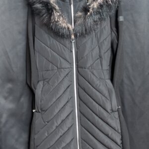 Close up of the inner tag for a Calvin Klein Performance black puffer jacket showing size large.