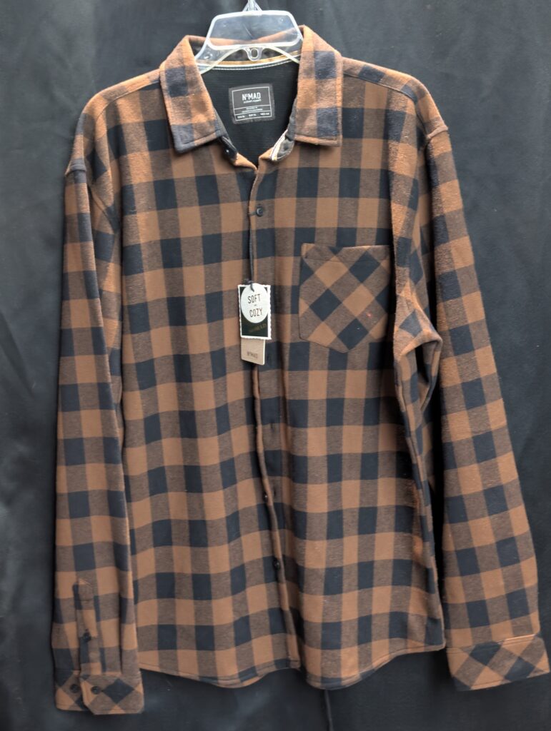 Brand new with tags Nomad brand size extra large soft and cozy brown and black buffalo plaid button down long sleeve flannel shirt perfectly displayed on a hanger.