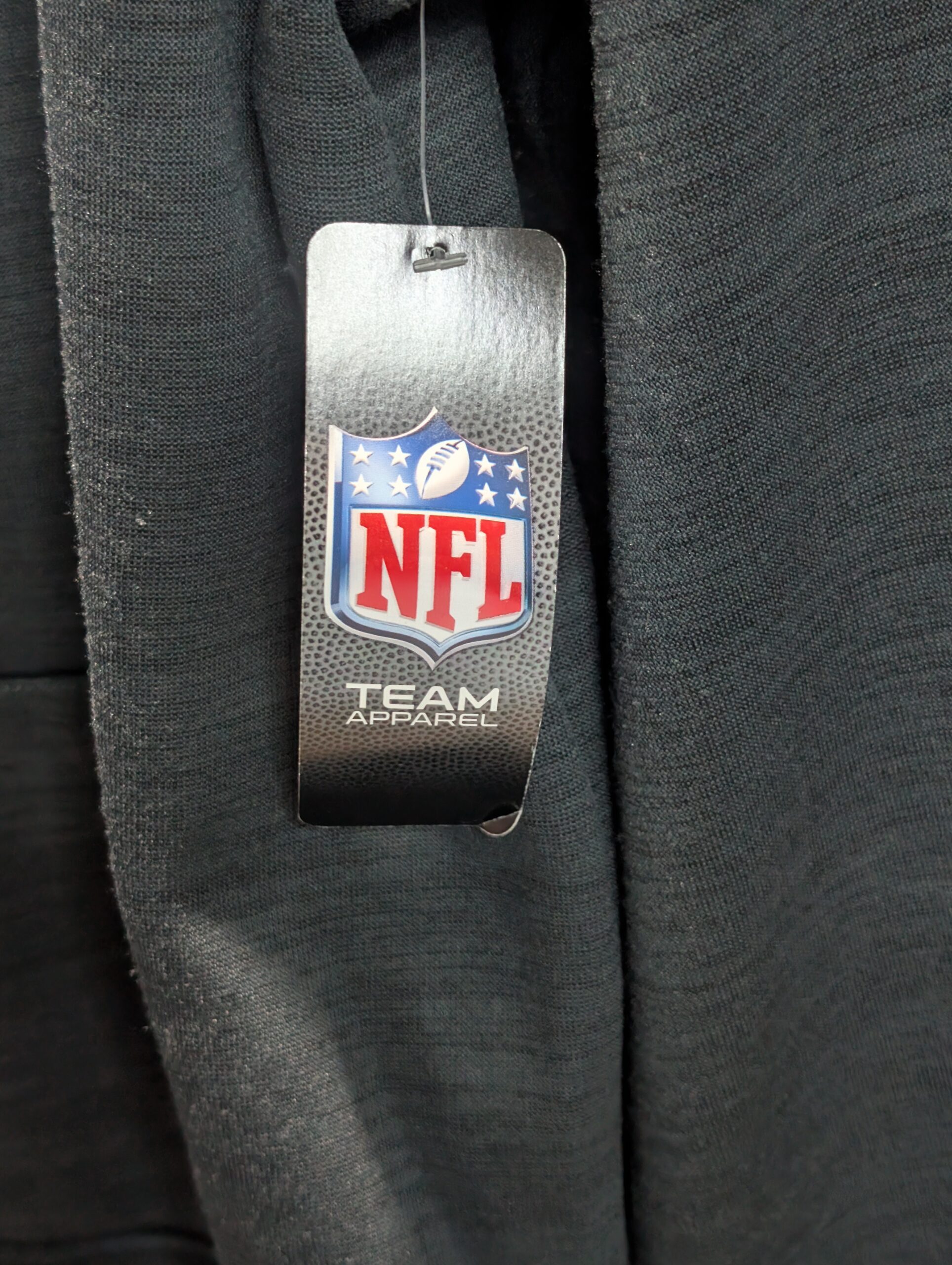 Brand new with tags official NFL Team Apparel size large Las Vegas Raiders heathered black pullover hoodie featuring classic team shield logo and convenient front kangaroo pocket today.