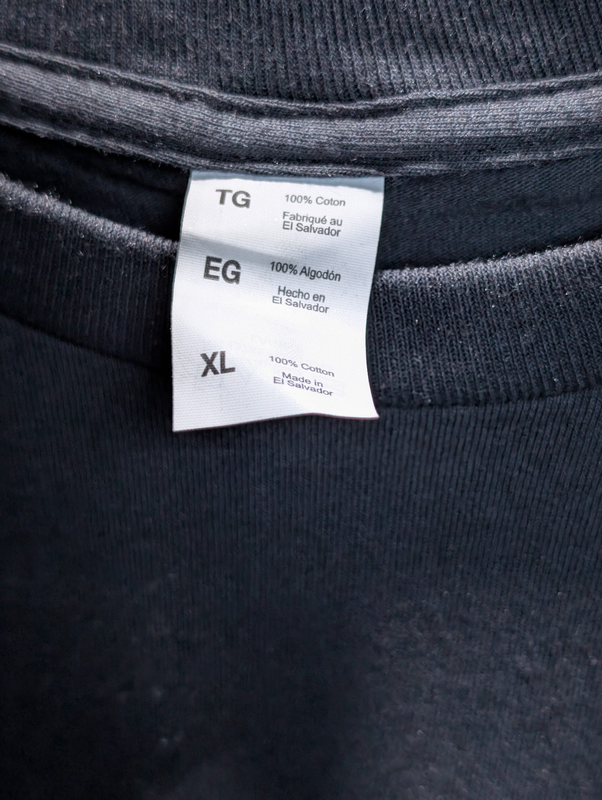 Black shirt featuring gold Sticky Canna drip logo.