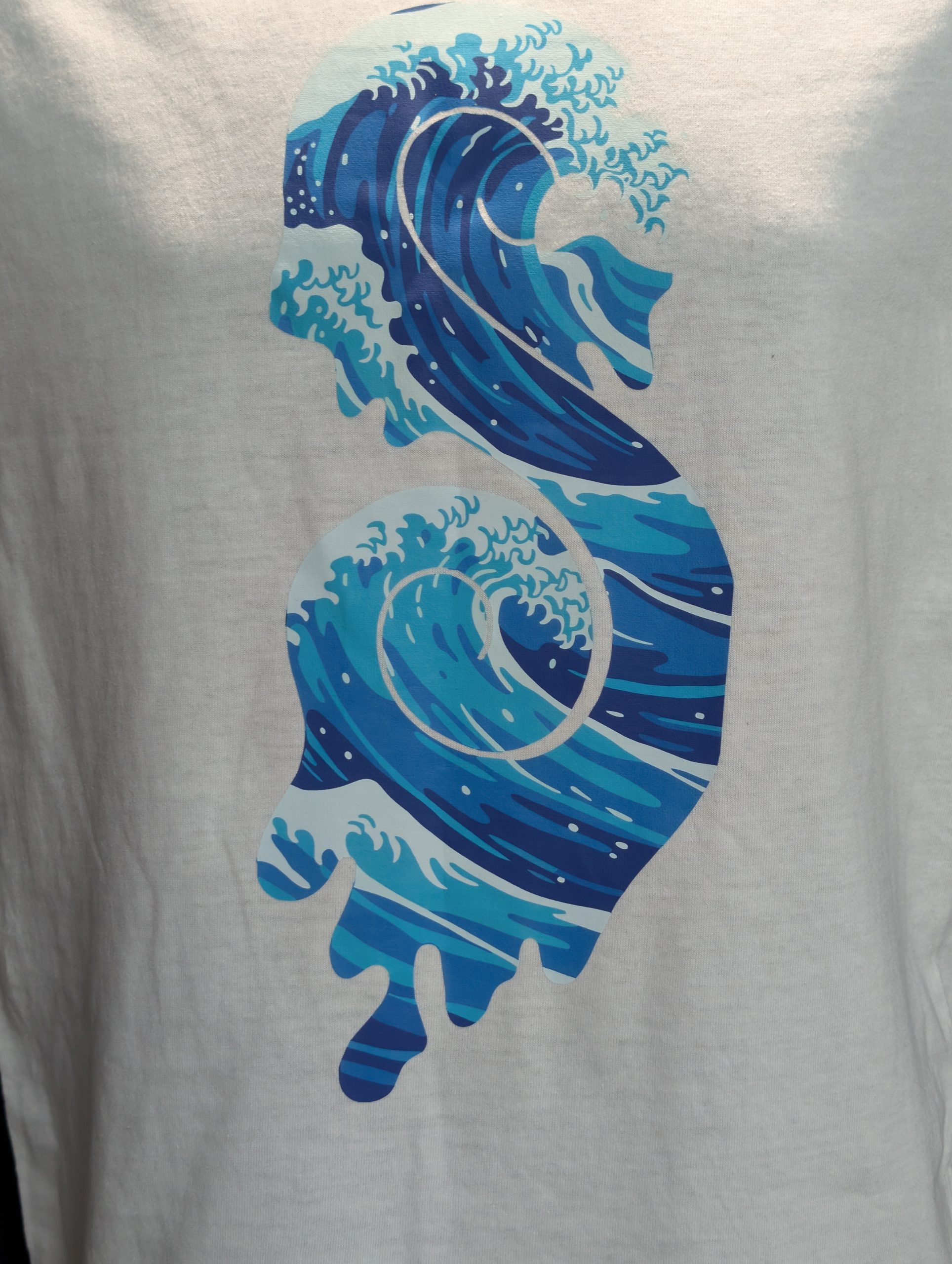 White shirt featuring blue wave Sticky Canna logo.