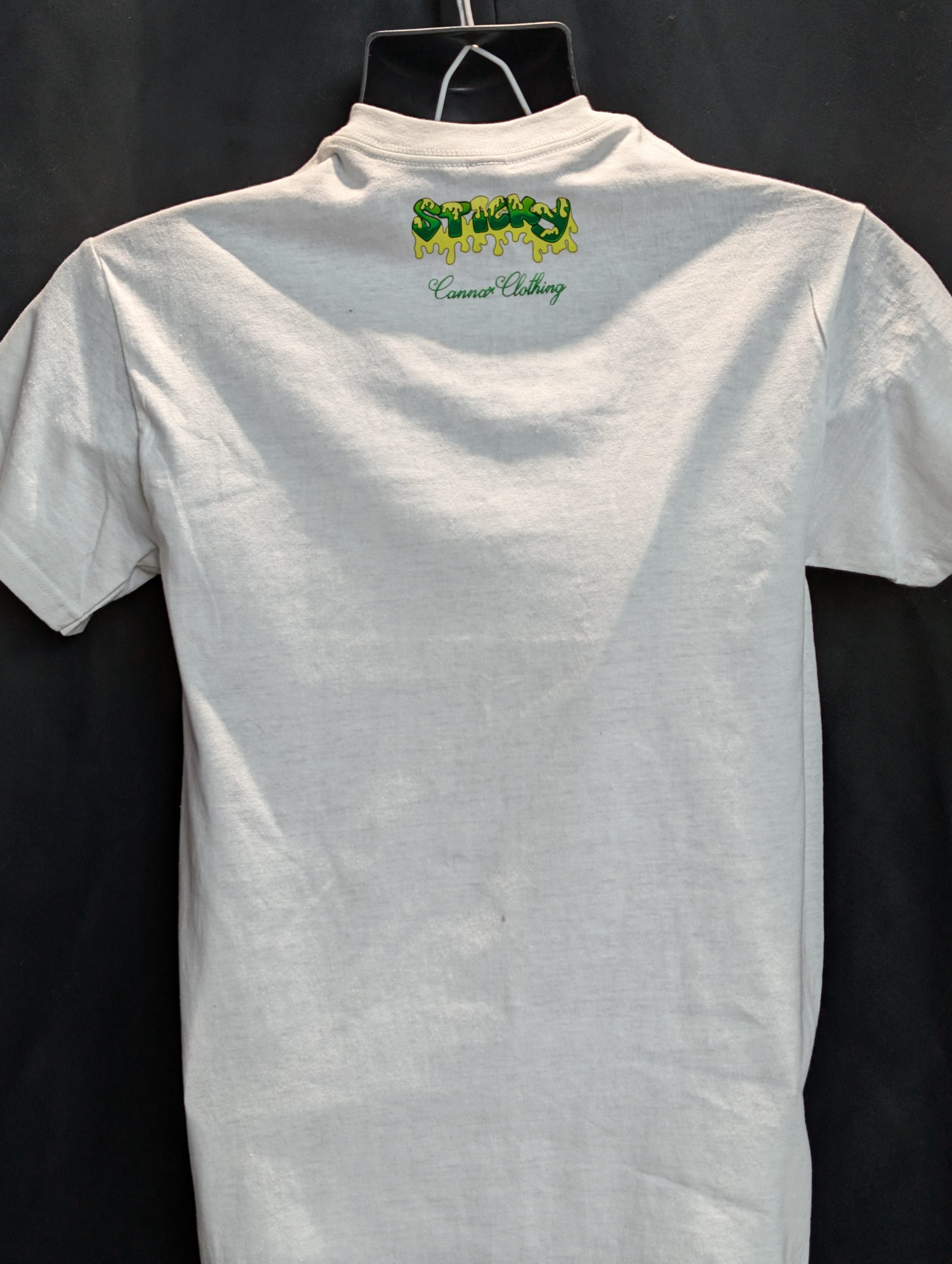 White shirt featuring blue wave Sticky Canna logo.