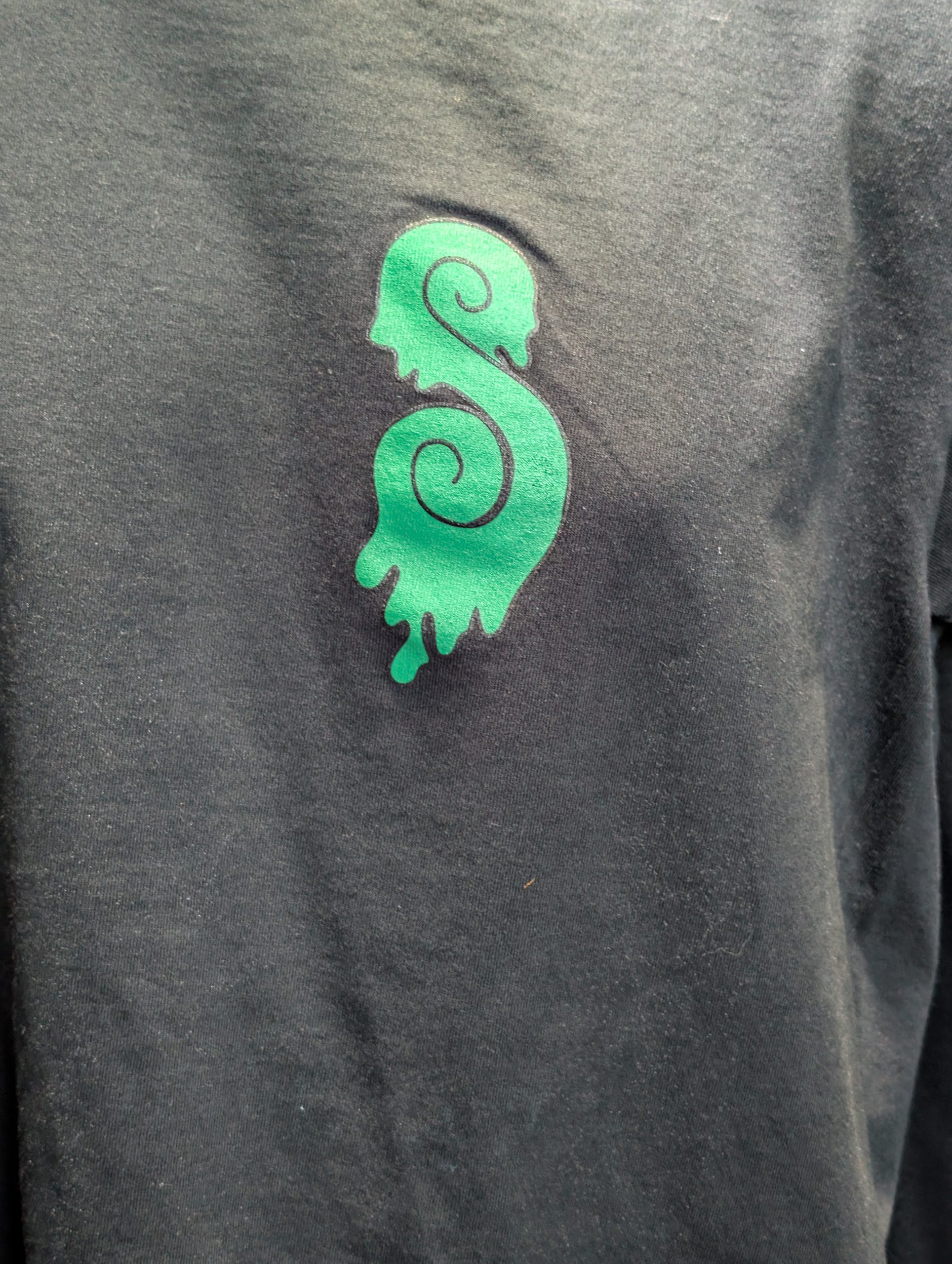 Black shirt featuring Earthy Gas smoking globe graphic.
