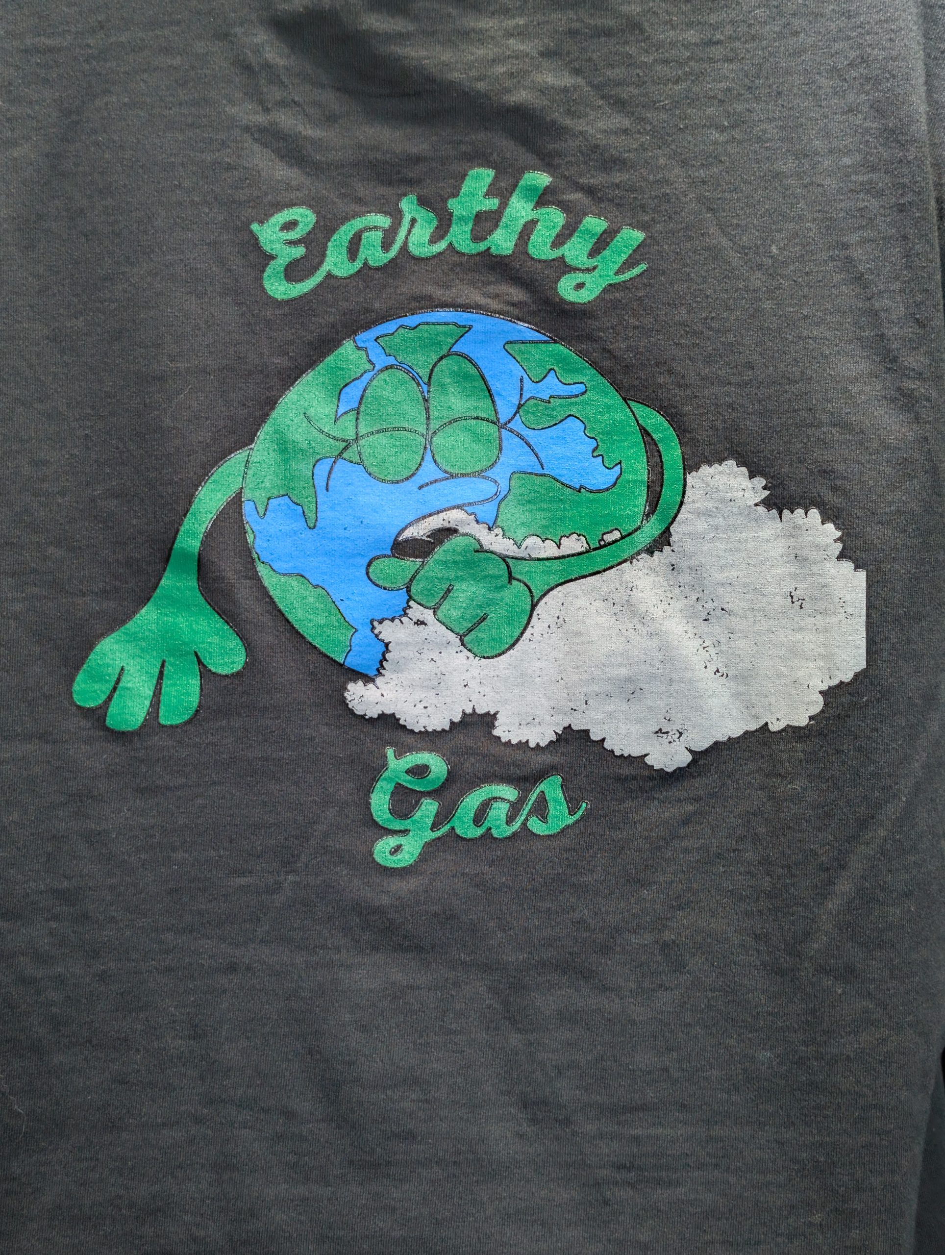 Black shirt featuring Earthy Gas smoking globe graphic.