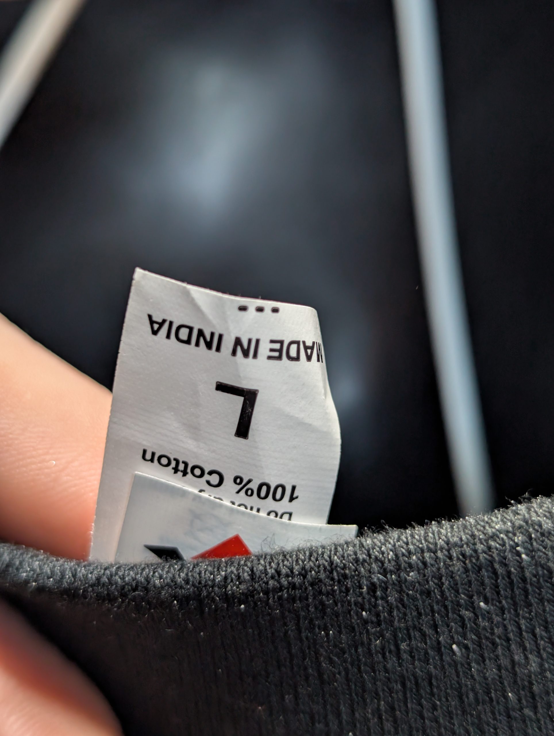 Black shirt featuring Earthy Gas smoking globe graphic Tag.