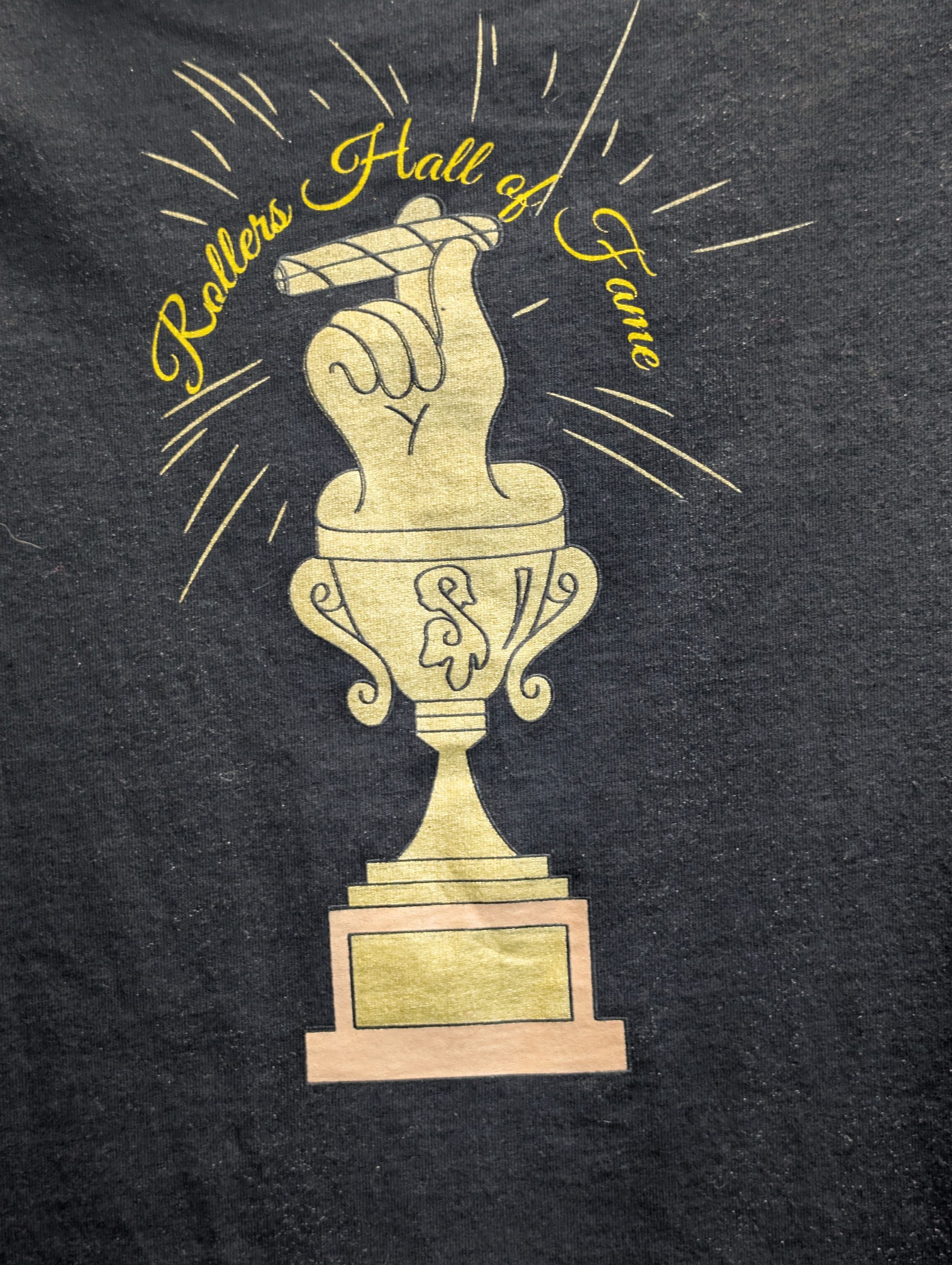 Black shirt featuring gold Rollers Hall of Fame.