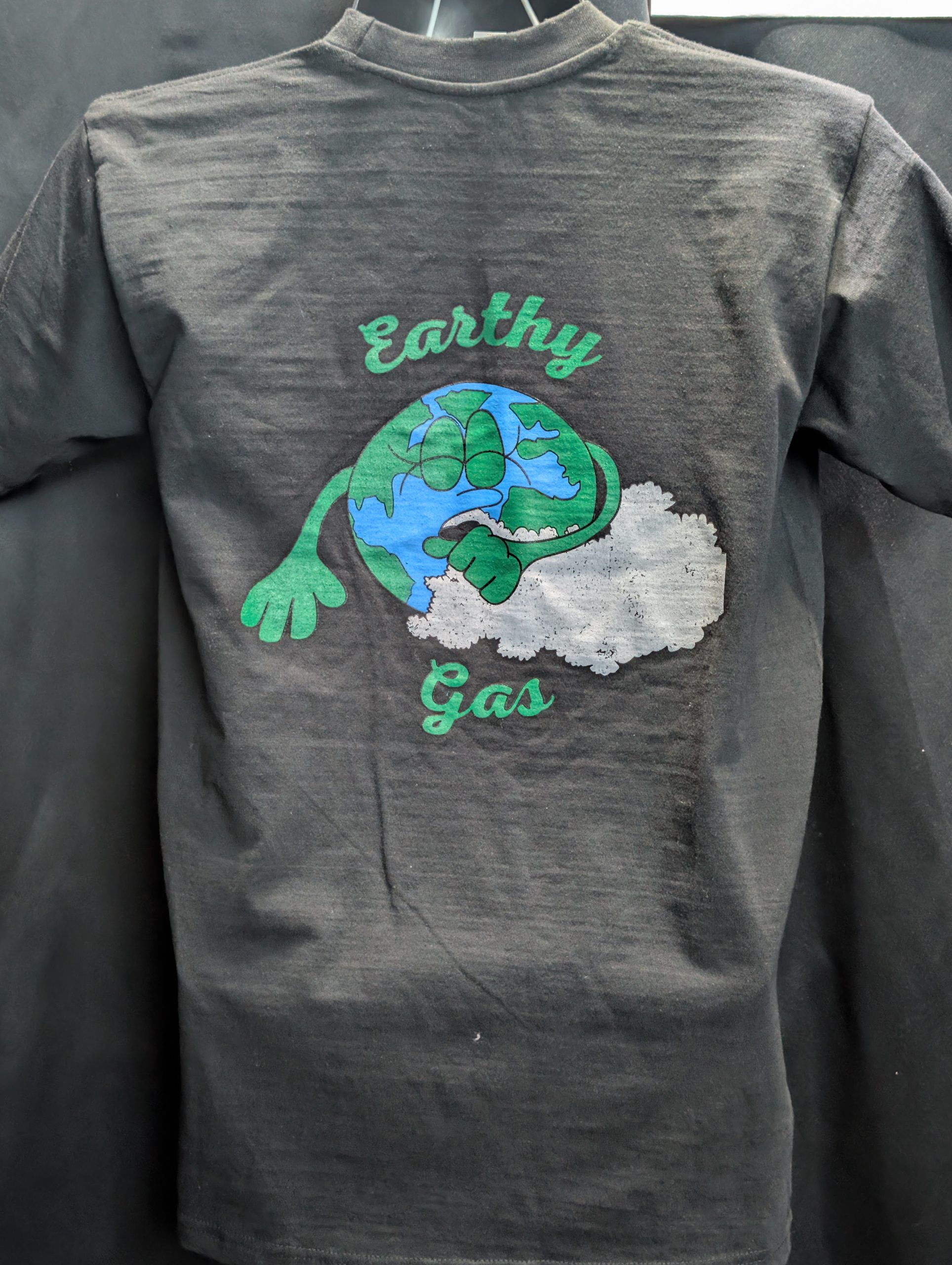 Black shirt featuring green Earthy Gas smoking globe.