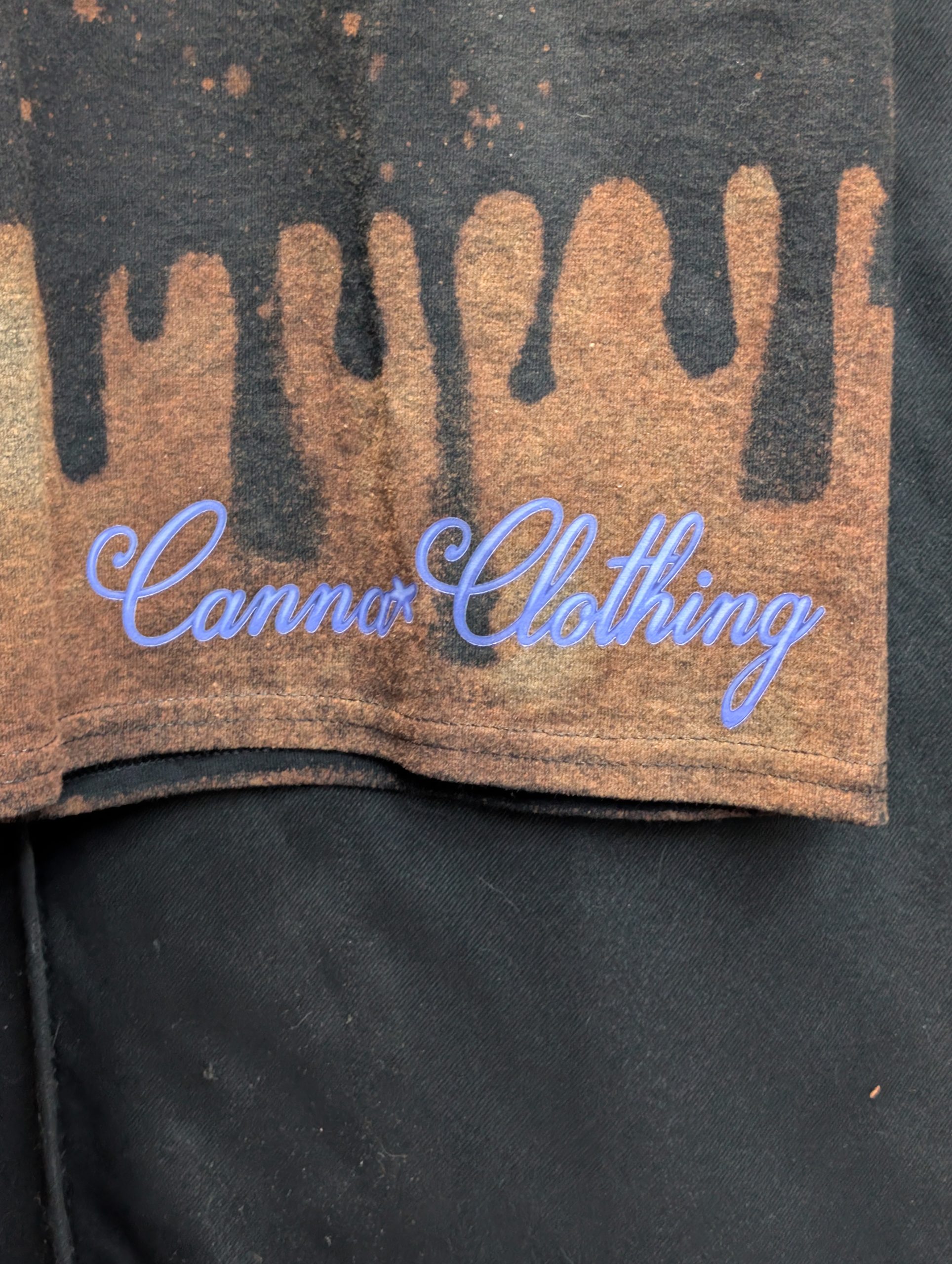 Black bleach washed shirt featuring blue Sticky logo.
