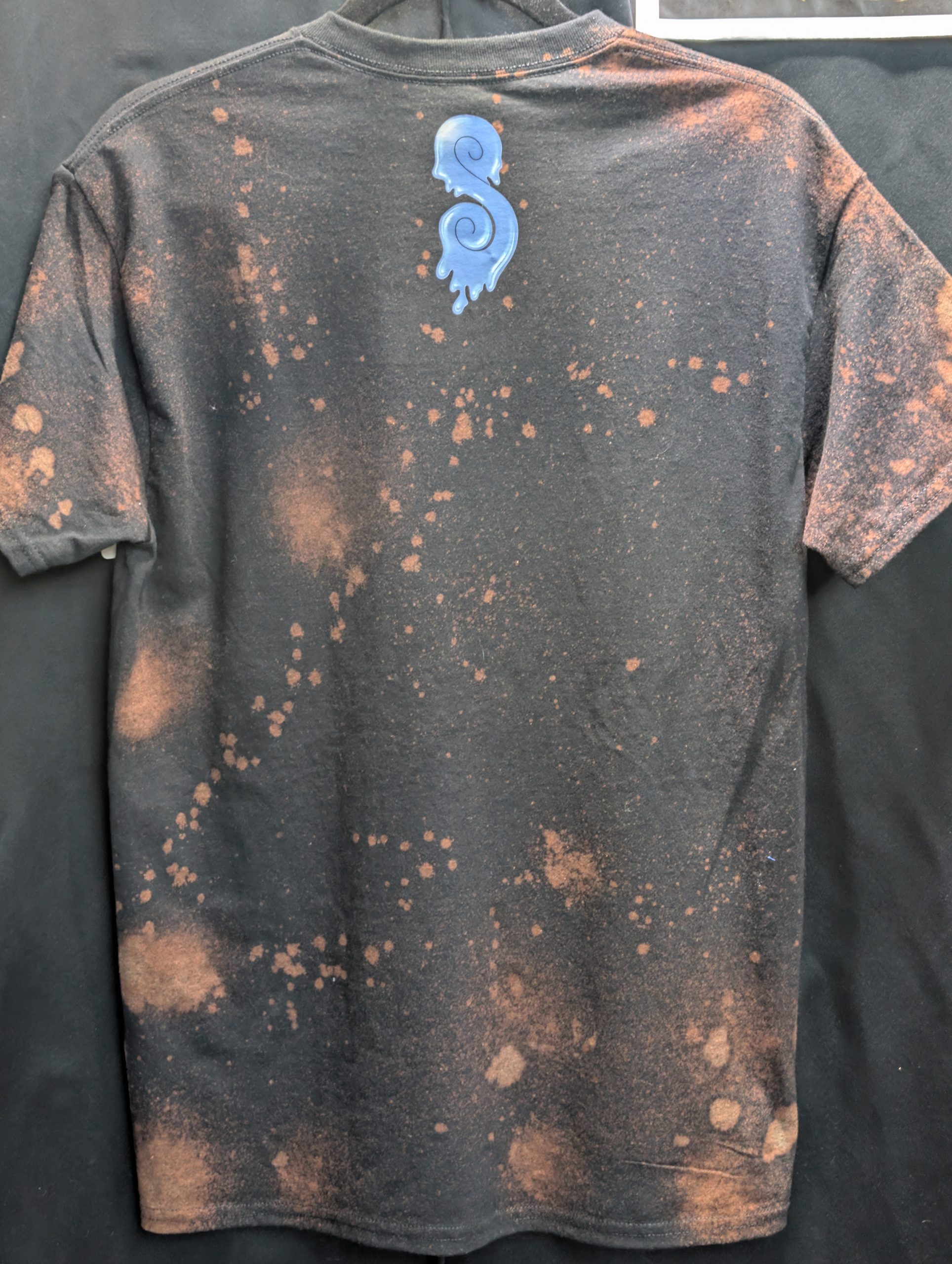 Black bleach washed shirt featuring blue Sticky logo.