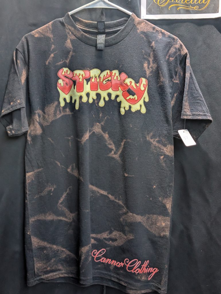 Black bleach washed shirt featuring red Sticky logo.