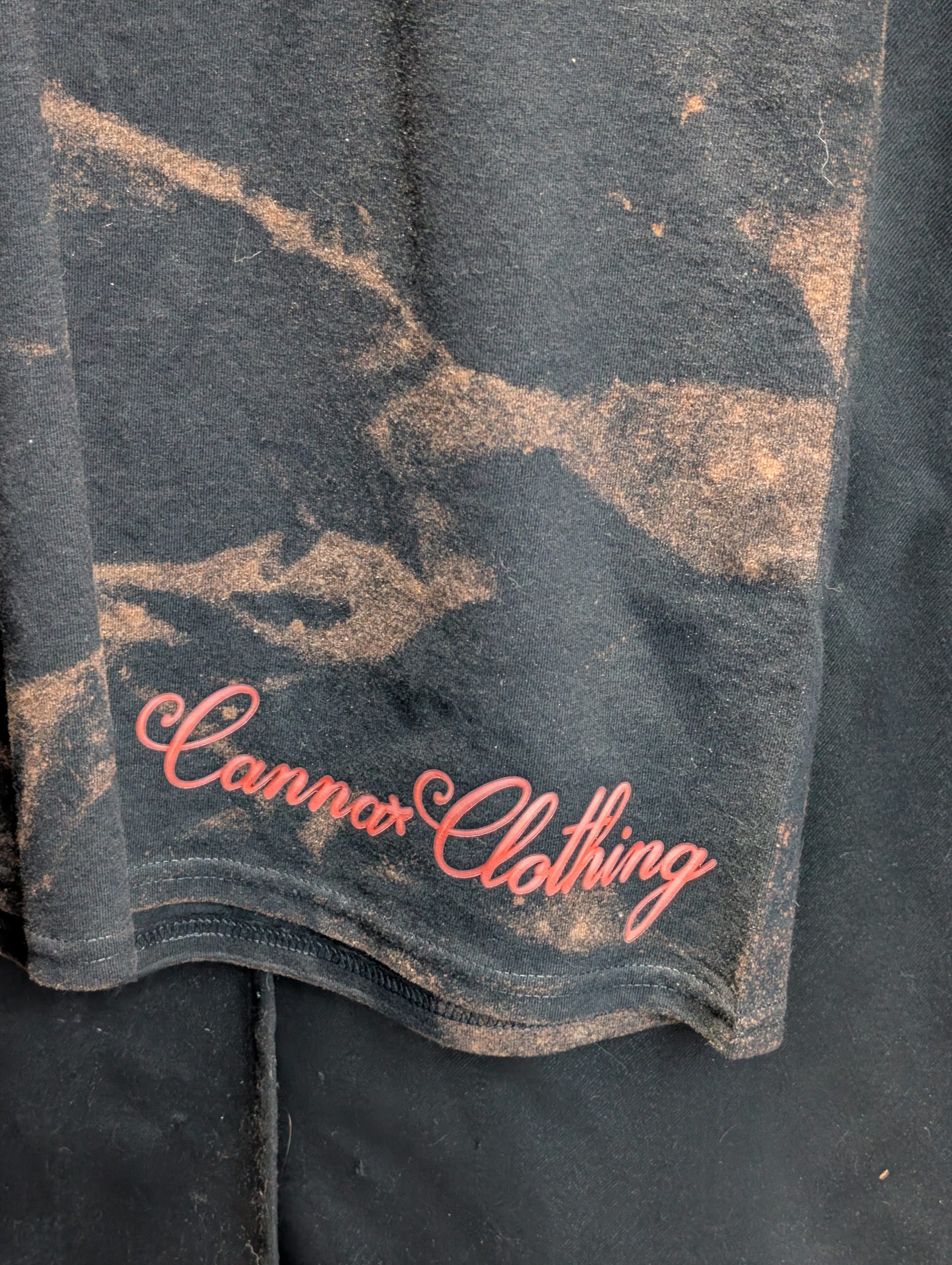Black bleach washed shirt featuring red Sticky logo.