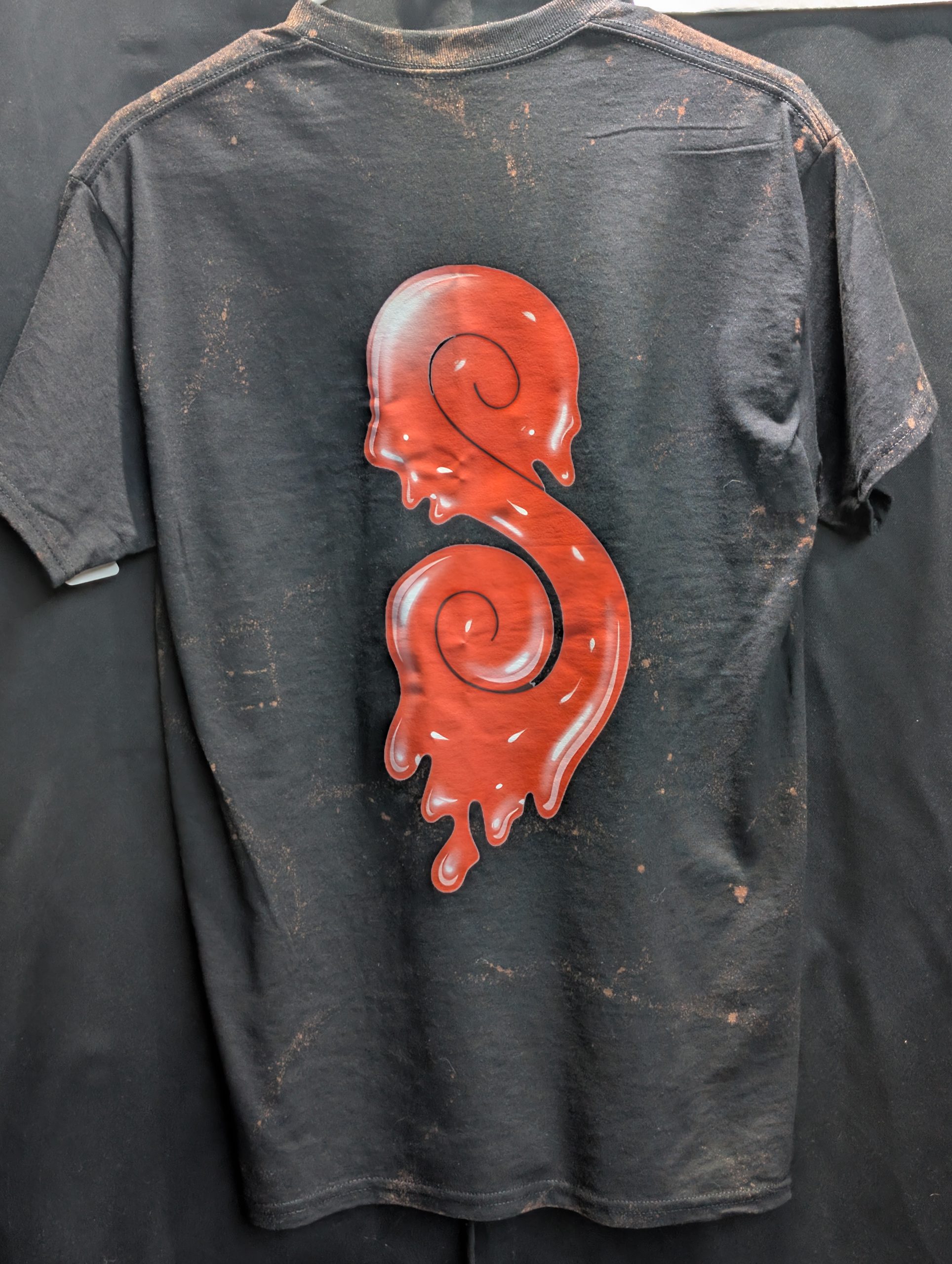 Black bleach washed shirt featuring red Sticky logo.