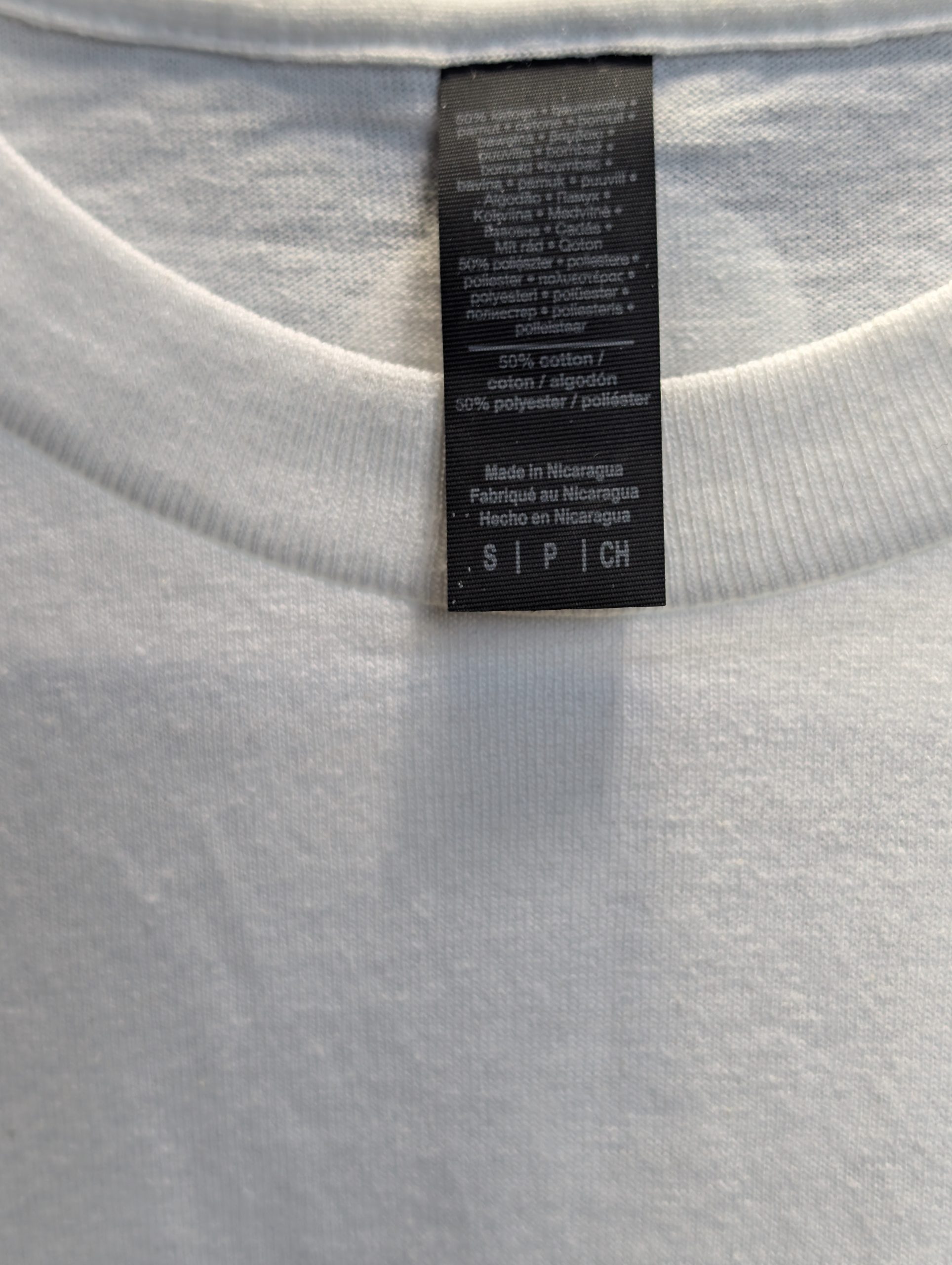 White shirt featuring red yellow Sticky Queens logo Tag size Small.