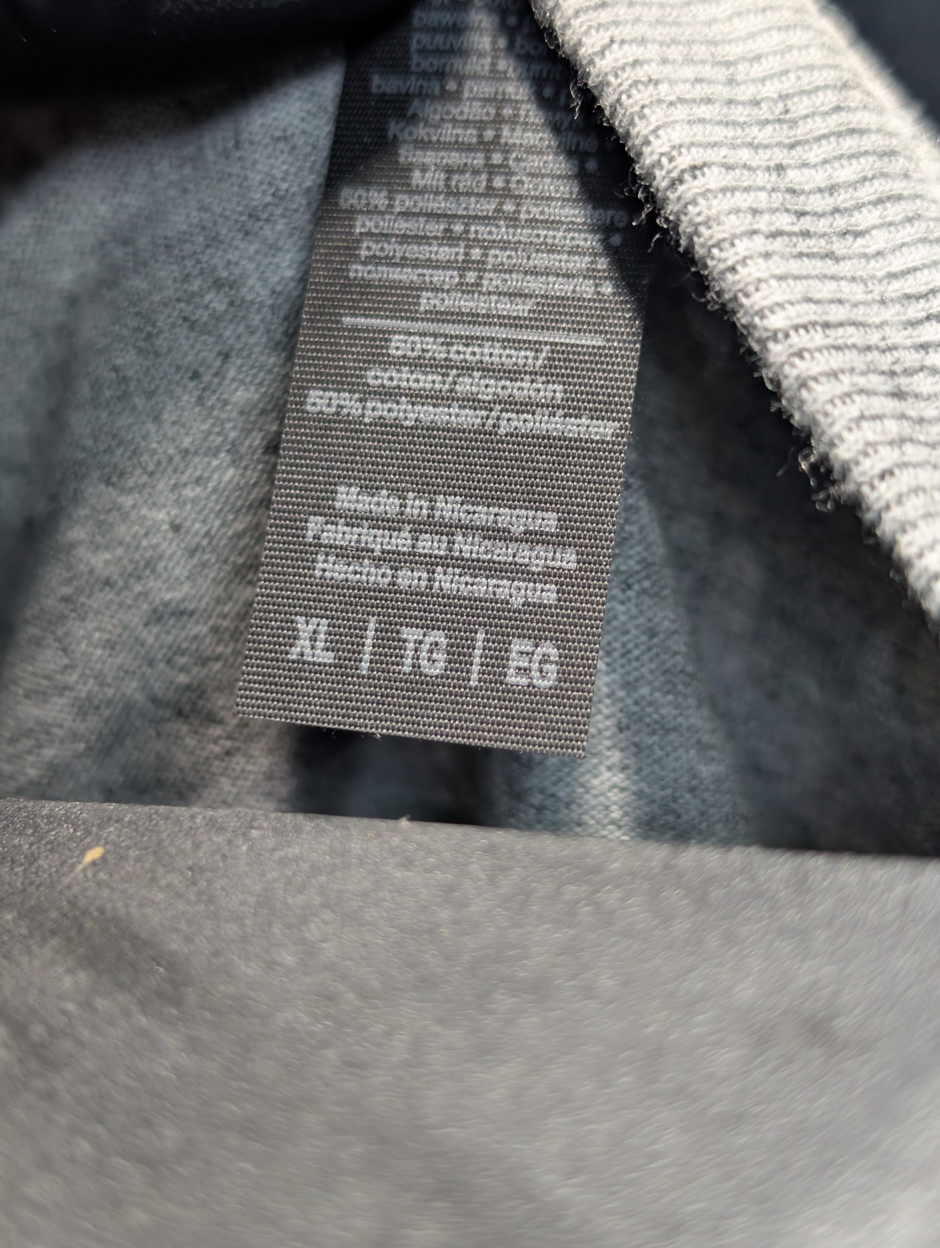 Grey shirt featuring blue wave Sticky Canna logo Tag XL.