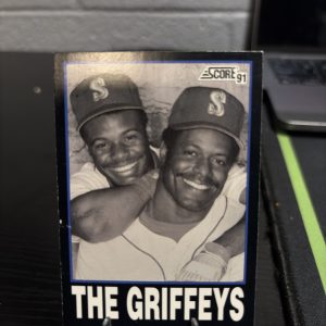 Vintage 1991 Score baseball trading card titled 'The Griffeys' featuring Ken Griffey Jr. and Ken Griffey Sr., a high-frequency collectible incorporated for your business success.