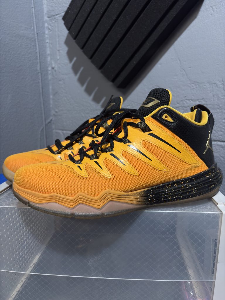 Jordan CP3.VIII basketball sneakers in orange and black, a high-frequency performance footwear item incorporated for your business success.