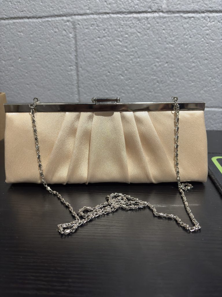 Jessica McClintock champagne pleated satin evening clutch with silver chain strap.