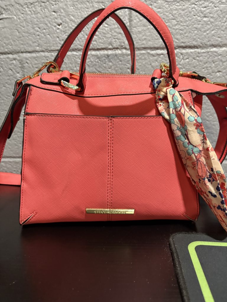 Hot pink Steve Madden structured satchel with gold-tone hardware and decorative floral scarf.