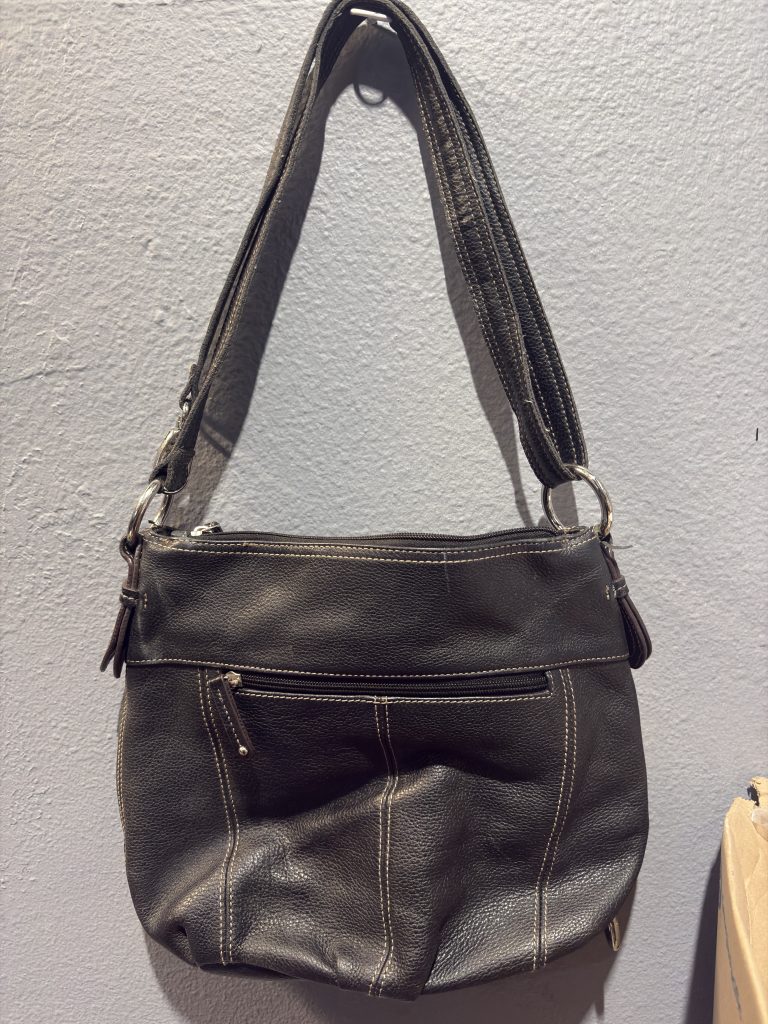Tignanello black pebbled leather shoulder bag with contrast stitching and signature lining.
