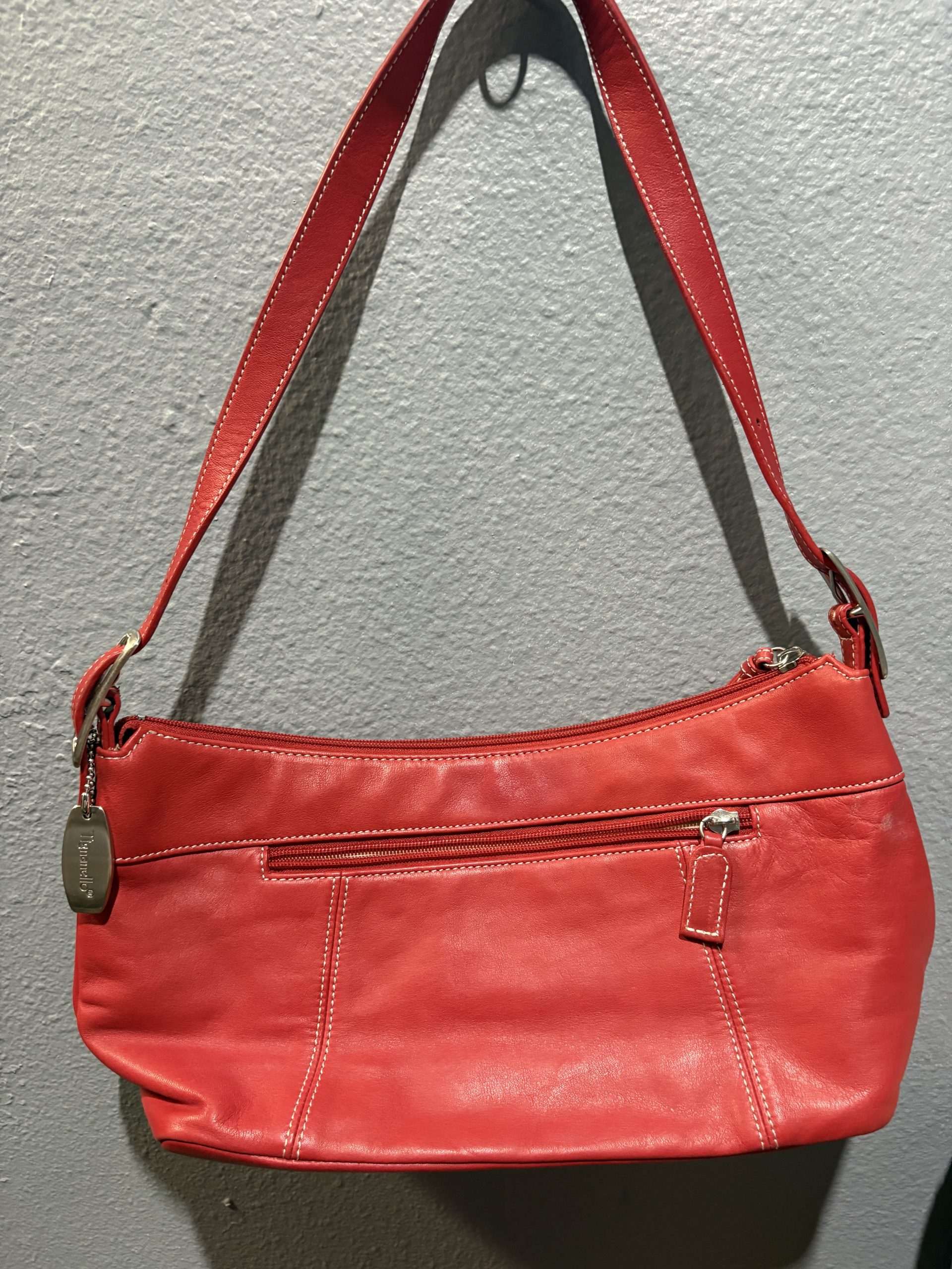 Tignanello red leather shoulder bag with white contrast stitching and silver hardware.