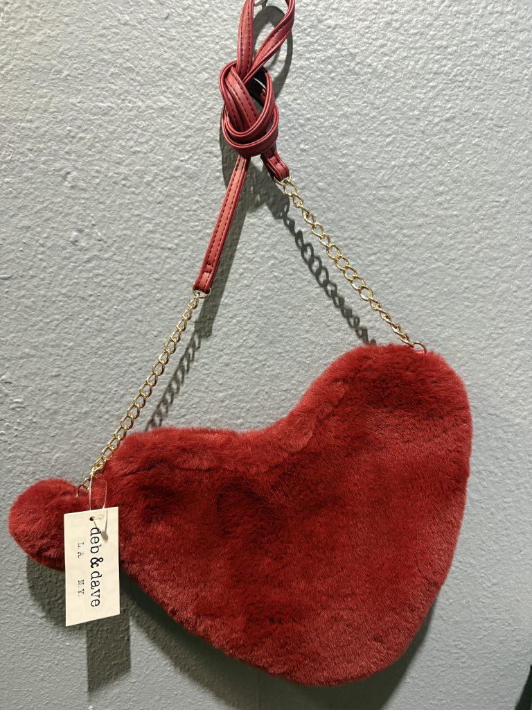 Vibrant red heart-shaped faux fur crossbody bag by Deb & Dave with gold chain strap.