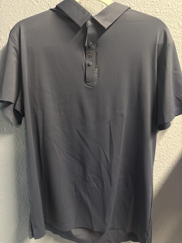 Premium charcoal grey polo shirt featuring embroidered equestrian logo and "THELATESTSTYLEPOLO" text on the placket.