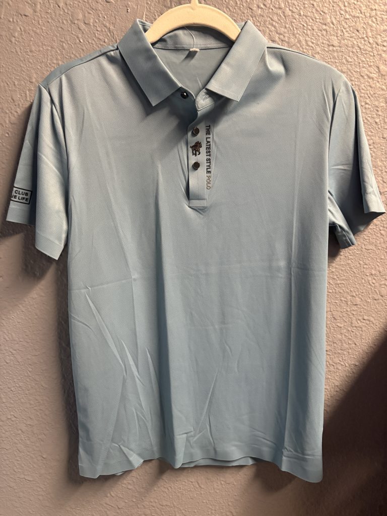 Premium light blue polo shirt featuring embroidered equestrian logo and "THELATESTSTYLEPOLO" text on the placket.