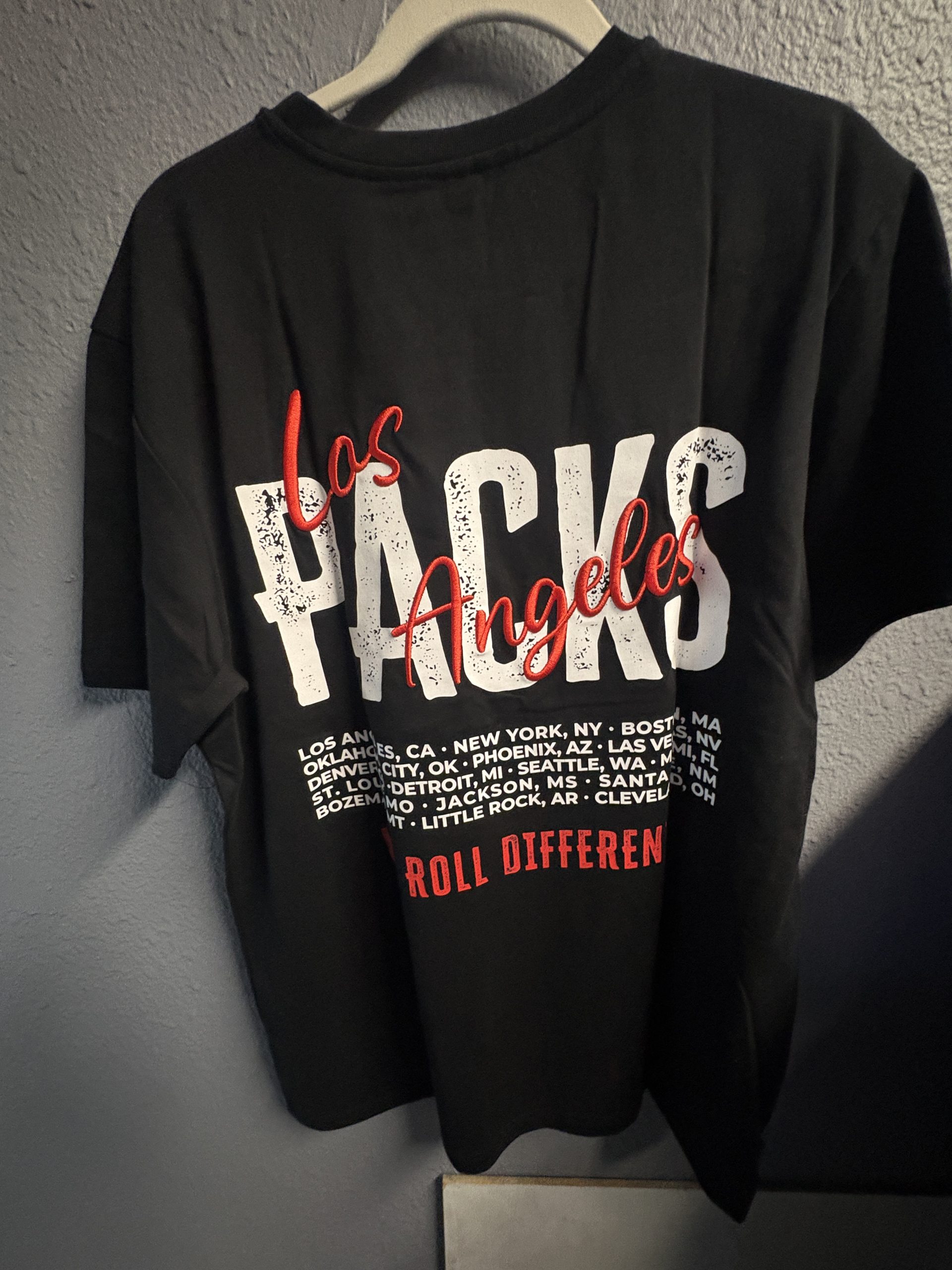 Los Angeles Packs premium black graphic t-shirt with embroidered front logo and city map back print.