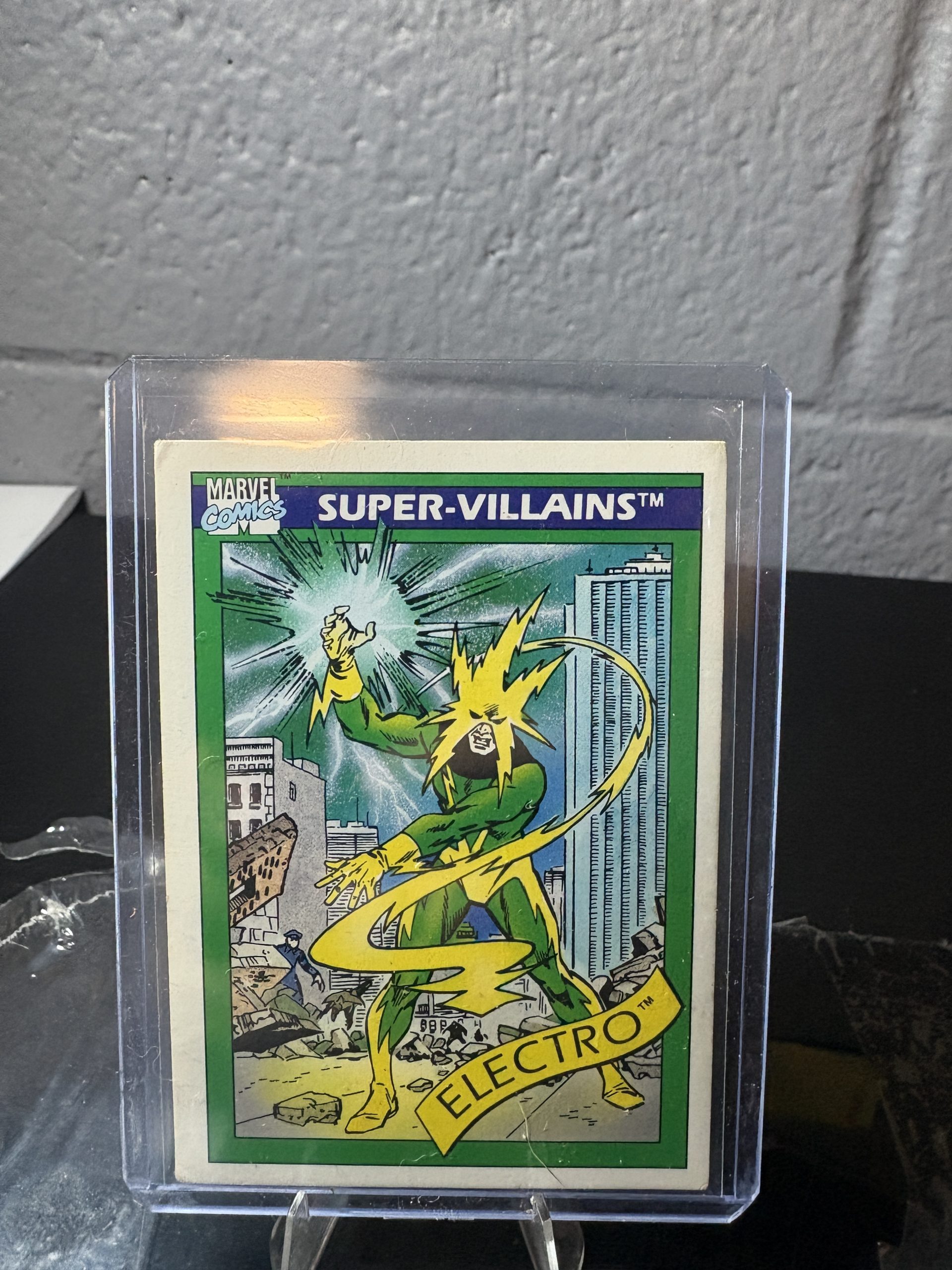 1990 Marvel Universe Electro trading card #58, Super-Villains series, featuring comic art in a protective case.