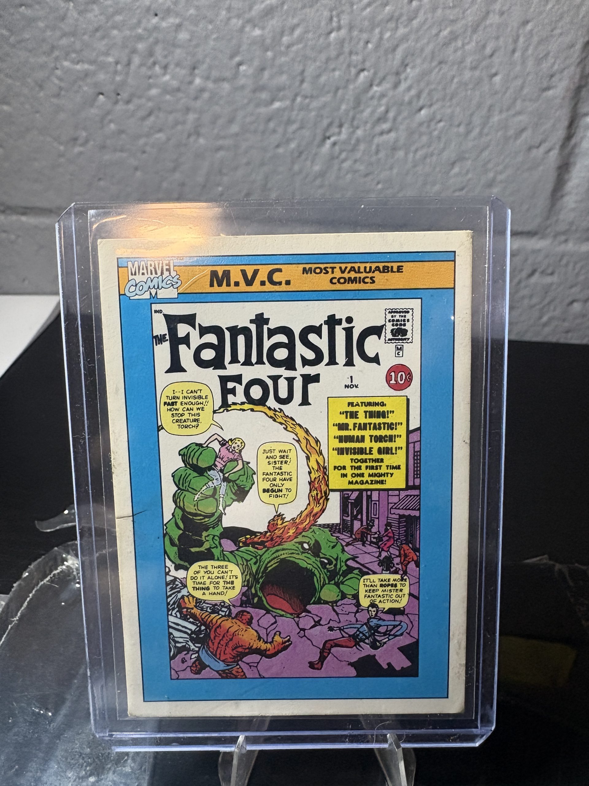 1990 Marvel Universe Fantastic Four #1 trading card #124, Most Valuable Comics series, featuring classic comic cover art in a protective case.