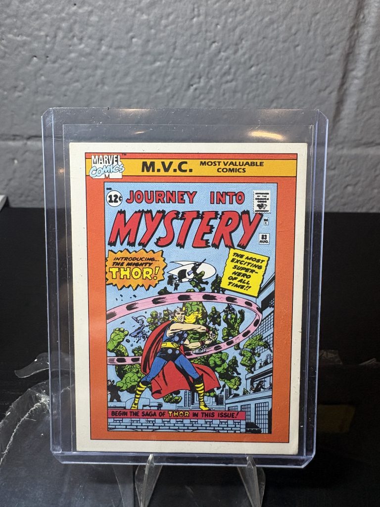 1990 Marvel Universe Journey Into Mystery #83 trading card #128, Most Valuable Comics series, featuring the debut of Thor in a protective case.