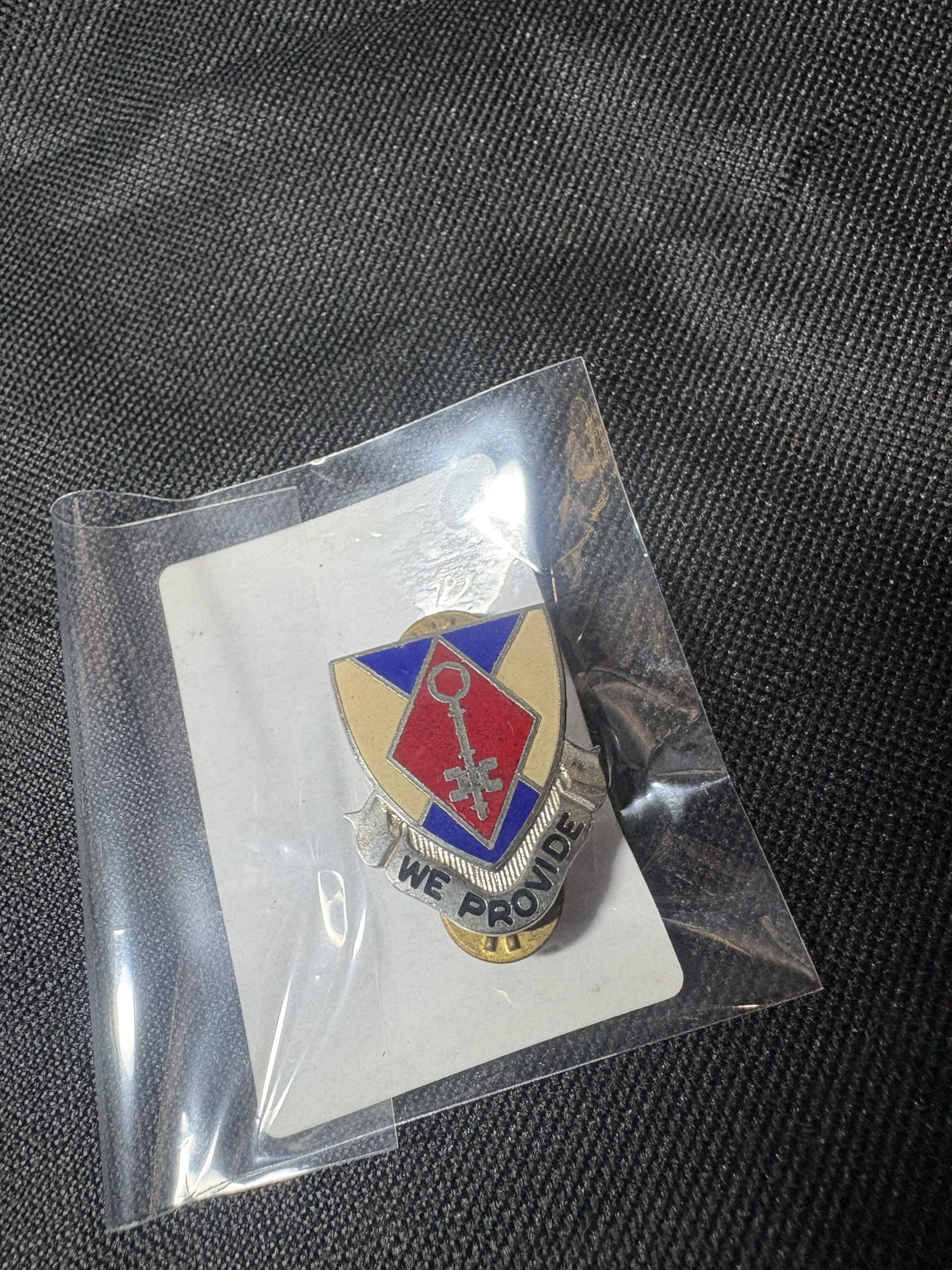 Vintage 72nd Ordnance Battalion "WE PROVIDE" Distinctive Unit Insignia (DUI) in a protective sleeve