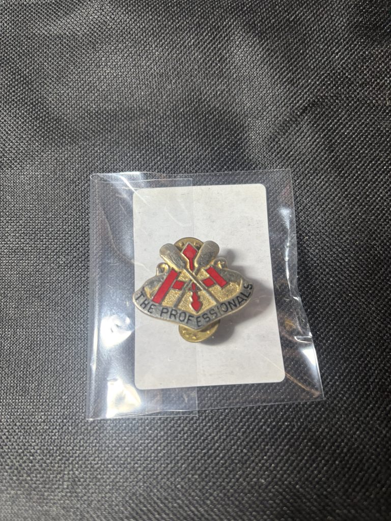 Vintage 37th Engineer Battalion "THE PROFESSIONALS" Distinctive Unit Insignia (DUI) in a protective sleeve.
