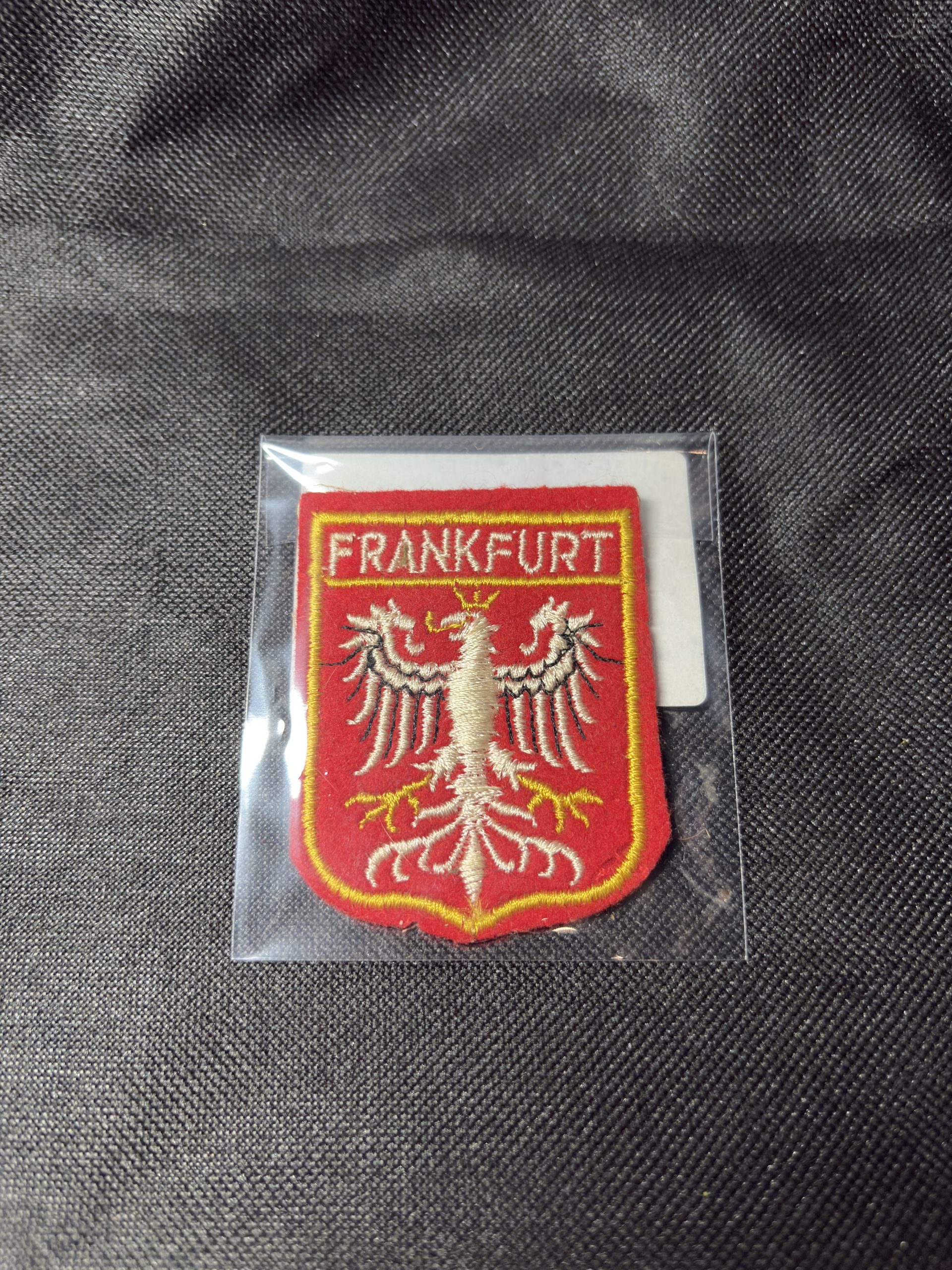 Embroidered Frankfurt city crest patch with eagle emblem, in a protective sleeve.