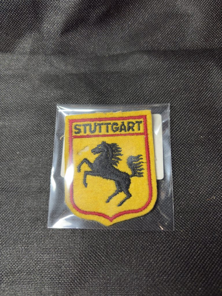 Vintage embroidered Stuttgart city crest patch with rearing horse design in a protective sleeve.