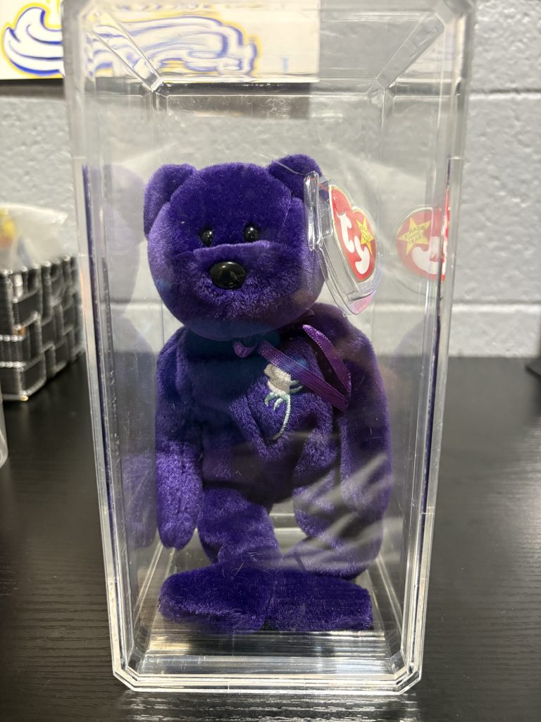 Ty Beanie Baby Princess purple bear with white rose embroidery and heart tag in protective case.