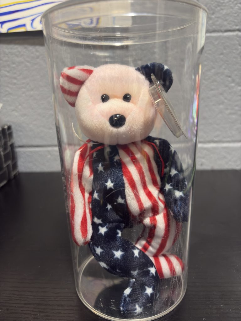 Ty Beanie Baby Spangle patriotic star and stripes bear with heart tag in a clear display cylinder.