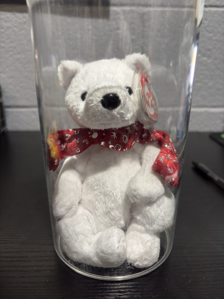 Ty Beanie Baby Holiday Teddy white bear with red metallic scarf in a clear display cylinder.