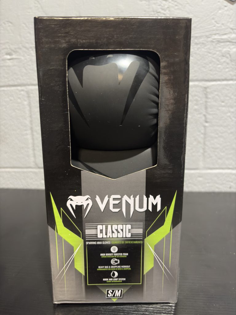 Venum Classic Sparring MMA Gloves in Black displayed with their packaging box and retail tag.