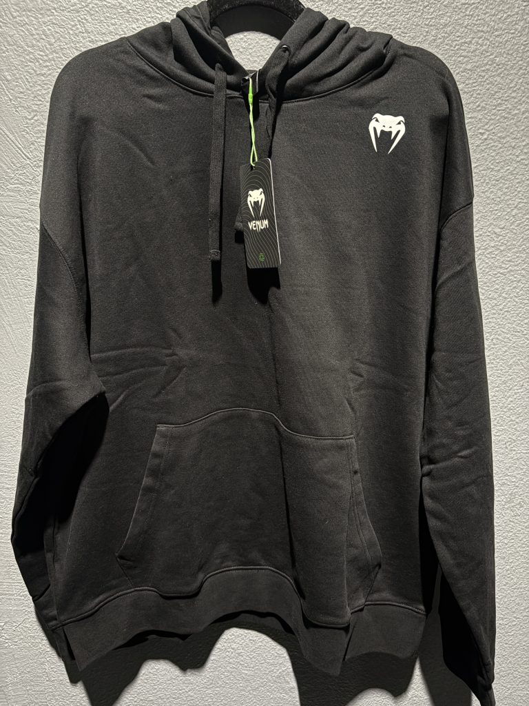 Venum Pullover Hoodie in Black showing the front chest logo, pocket, and brand tag in size XL.