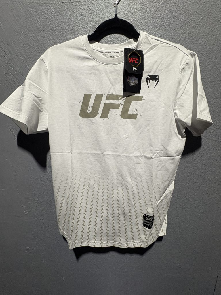 UFC x Venum Authentic Fight Week T-Shirt in white showing the chest logo, tags, and size S neck label.