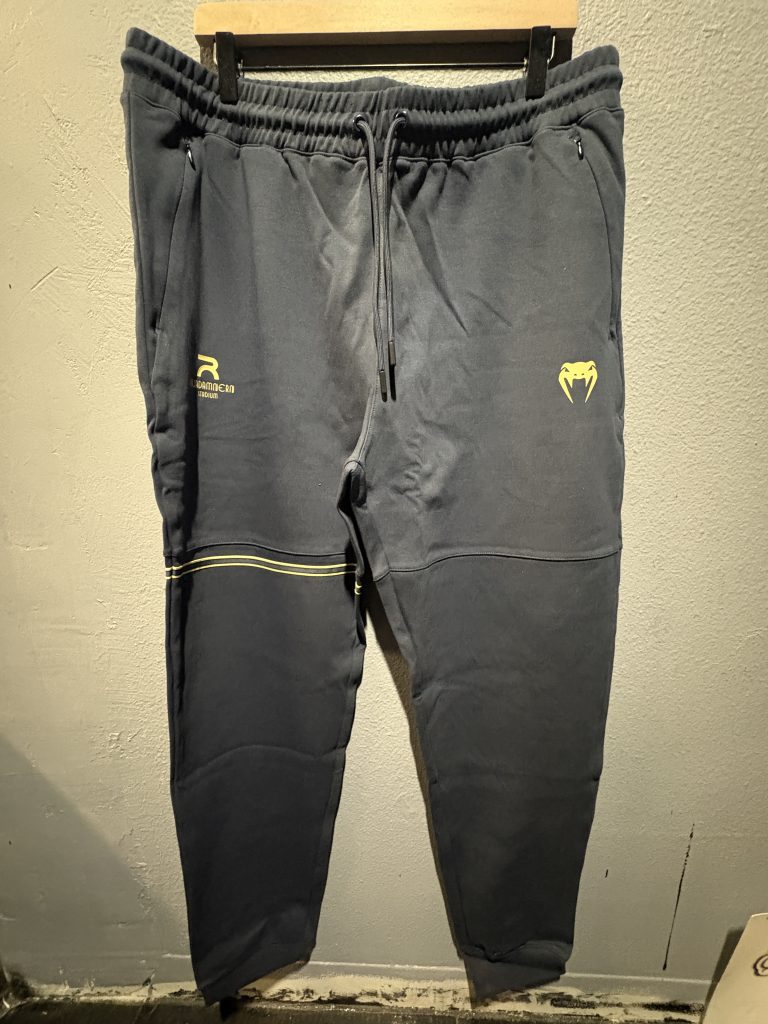 Raja x Venum Joggers in Navy Blue showing the waistband, tag, and gold graphics in size XXL.