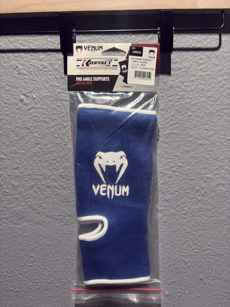 Venum Kontact Ankle Guard in Blue inside original clear packaging showing the header card and "Unique" size label.
