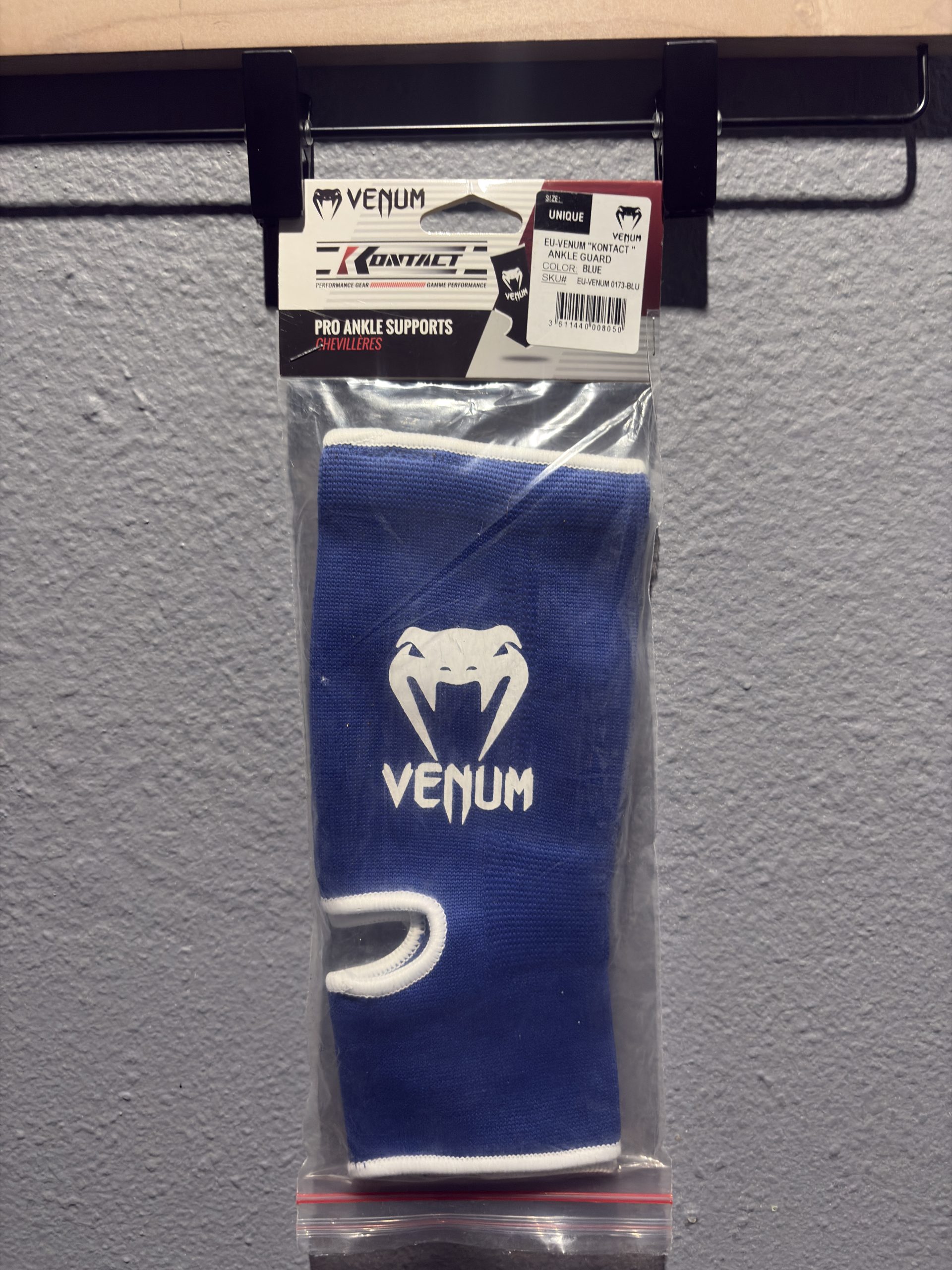 Venum Kontact Ankle Guard in Blue inside original clear packaging showing the header card and "Unique" size label.