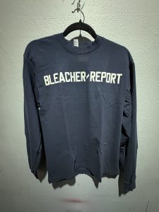 Los Angeles Apparel Bleacher Report embroidered long sleeve t-shirt in navy blue showing the front chest branding and size S tag.